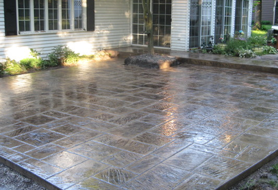 Lansing stamped concrete job of a stamped patio outside a residential home in a subdivision. 