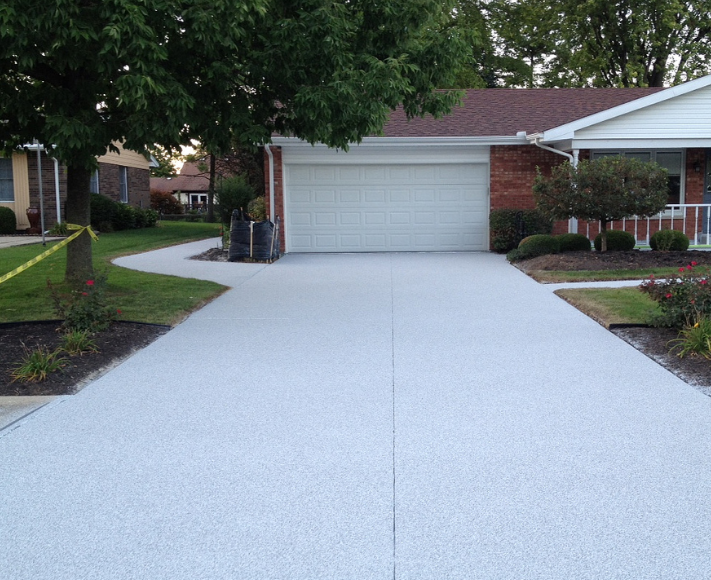 White brooms finished concrete driveway in Lansing, Michigan. 