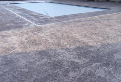 Decorative concrete of a pool deck in Lansing. 