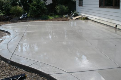 Smooth finished concrete patio in a home in Lansing.